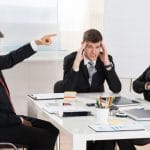 46636958 – mature businessman arguing with his two co-workers in office