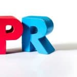 26312686 – multicolored text pr made of wood. white background