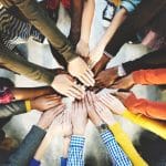 52414187 – group of diverse hands together joining concept