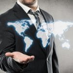 35750162 – businessman with open palm showing world map
