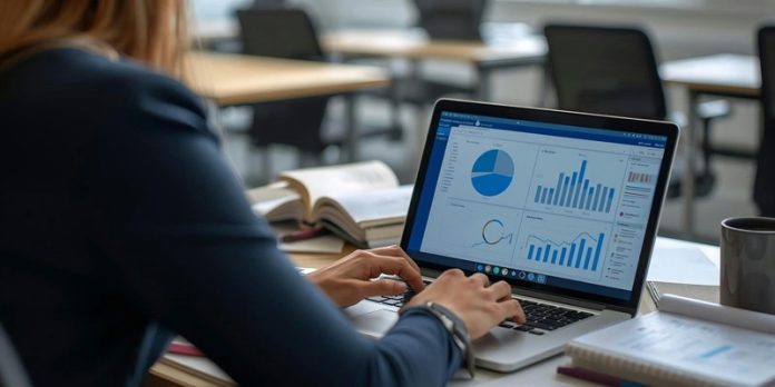 woman with business data on laptop screen
