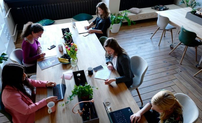 women in coworking meeting
